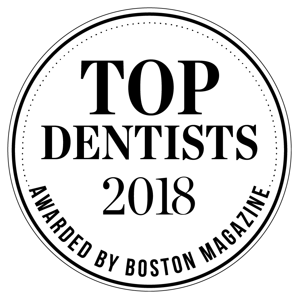 The 'Top Dentists' award logo by Boston Magazine, featuring an elegant design that honors excellence in dentistry.